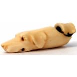 Late 19th century ivory whistle modelled in the form of a hounds head (a/f), length 6.5cm