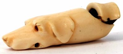 Late 19th century ivory whistle modelled in the form of a hounds head (a/f), length 6.5cm