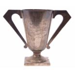George V presentation engraved two handled trophy cup, in the Art Deco manner, with hollow cast