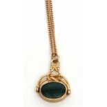 9ct gold framed swivel fob, oval shaped with a bloodstone and onyx panel, suspended from a filed