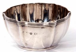 Early 20th century silver sugar bowl of shaped circular form with applied reeded rim, diam 9cm,