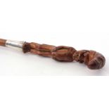 White metal mounted figural walking stick, the carved handle modelled as a standing portly gentleman