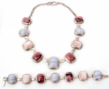 Cased white metal necklace set with nine rectangular shaped polished stones, bezel set, and joined