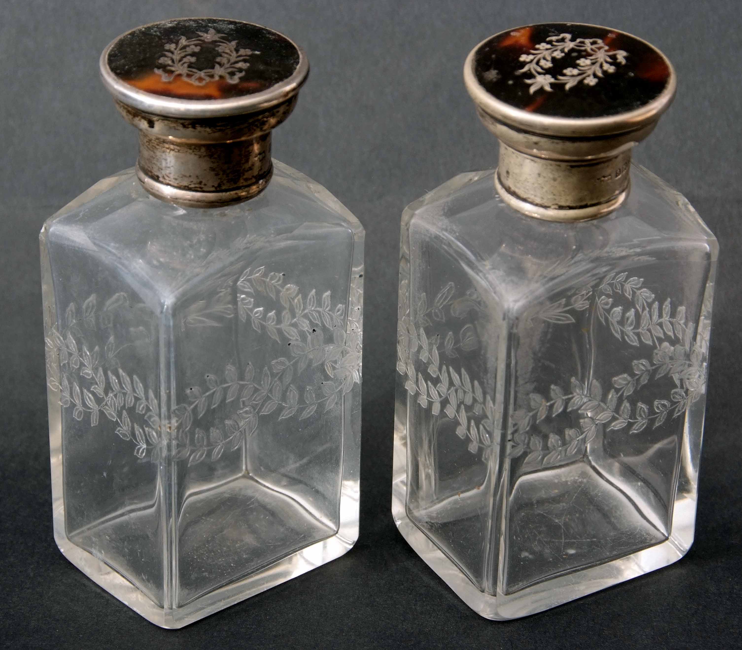 Two George V silver and tortoiseshell mounted clear glass toiletry bottles each of rectangular - Image 2 of 2