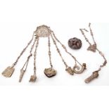 Late 19th/early 20th century base metal chatelaine, the cast mount with hinged clasp, stamped "