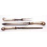 George V silver handled three piece carving set comprising safety fork, carving knife and steel,