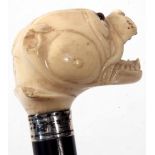 Late 19th/early 20th century ivory and ebonised walking stick, the carved head modelled in the