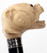 Late 19th/early 20th century ivory and ebonised walking stick, the carved head modelled in the