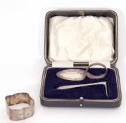 Mixed Lot: comprising a cased child's feeding spoon and pusher, together with a mis-shapen napkin