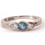 Aquamarine and diamond three stone ring, the central aquamarine flanked by two brilliant cut