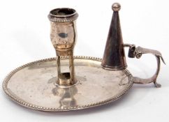 George III chamber stick of typical saucer form with scrolling thumb piece handle (a/f and repaired)
