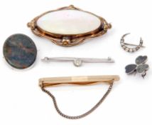 Mixed Lot: to include a large nacre shell brooch in a gilt metal mount, an oval bloodstone brooch, a