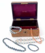 Small Victorian leather jewel box to include a vintage coral bead necklace, two crystal necklaces