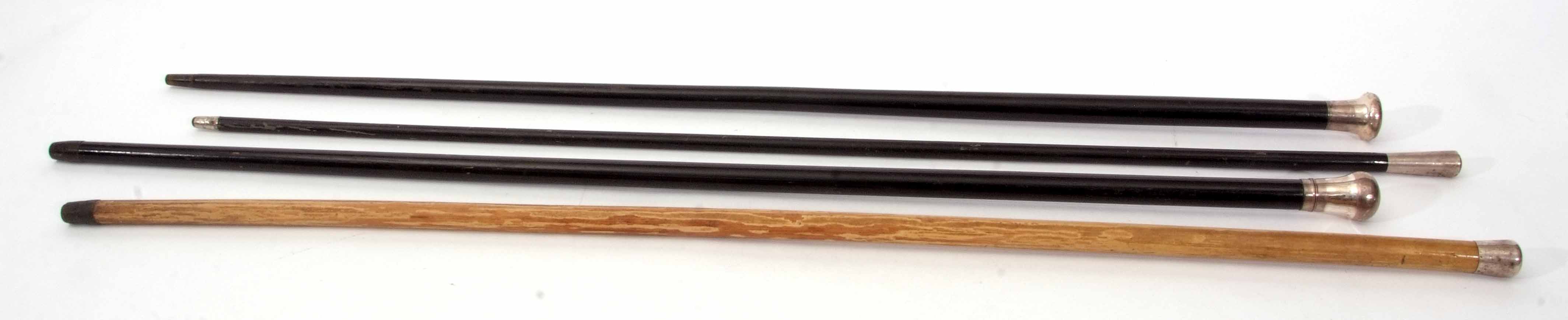 Mixed Lot: comprising three various ebonised and silver capped walking sticks, together with a - Image 3 of 4