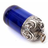 White metal mounted and cobalt blue glass phial, the screw down foliate embossed cover with ring