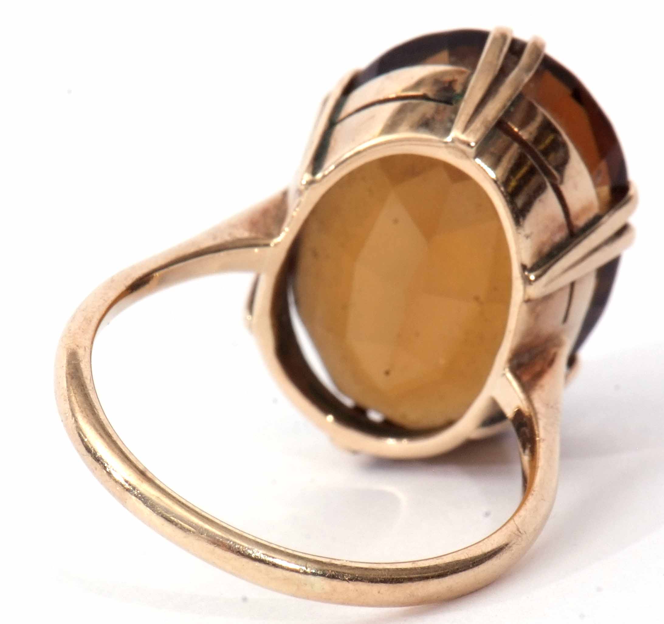 A 9ct stamped citrine dress ring, oval shaped (20 x 14mm), faceted design, claw set and raised in - Image 3 of 5