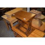 OAK FRAMED SET OF THREE NESTING TABLES ON TURNED SUPPORTS