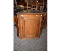 19TH CENTURY OAK FRAMED WALL MOUNTED CORNER CUPBOARD WITH SINGLE PANELLED DOOR