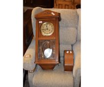 OAK FRAMED MANTEL CLOCK TOGETHER WITH A FURTHER WALL CLOCK WITH SILVERED DIAL AND GLASS DOOR (2)