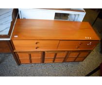 TEAK FRAMED SIDEBOARD WITH FOUR DRAWERS OVER THREE PANELLED CUPBOARD DOORS