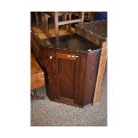 EARLY 19TH CENTURY OAK CORNER MOUNTED CUPBOARD WITH SINGLE PANELLED DOOR AND BRASS BUTTON HANDLE