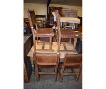 SET OF SIX RUSTIC ARTS & CRAFTS TYPE DINING CHAIRS WITH OAK FRAMES AND TAN LEATHER SEAT AND BACK