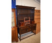 EARLY 19TH CENTURY OAK FRAMED DRESSER, THE TOP FITTED WITH TWO SHELVES WITH PANELLED BACK, THE