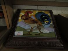 WALNUT FRAMED MUSICAL TEAPOT STAND WITH A TILE OF A COCKEREL