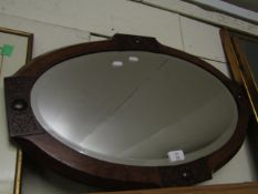 OVAL WALNUT FRAMED WALL MIRROR WITH CARVED DETAIL