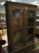 OAK FRAMED BOOKCASE WITH TWO GLAZED DOORS AND ADJUSTABLE SHELVES