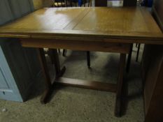 MID 20TH CENTURY OAK FRAMED DRAWER LEAF DINING TABLE