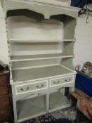 GOOD QUALITY GREEN AND CREAM PAINTED DRESSER WITH TWO OPEN SHELVES, THE BASE WITH TWO DRAWERS WITH