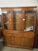 YEW WOOD BOOKCASE WITH TWO ASTRAGAL GLAZED DOORS TO TOP, BASE FITTED WITH THREE DRAWERS OVER THREE