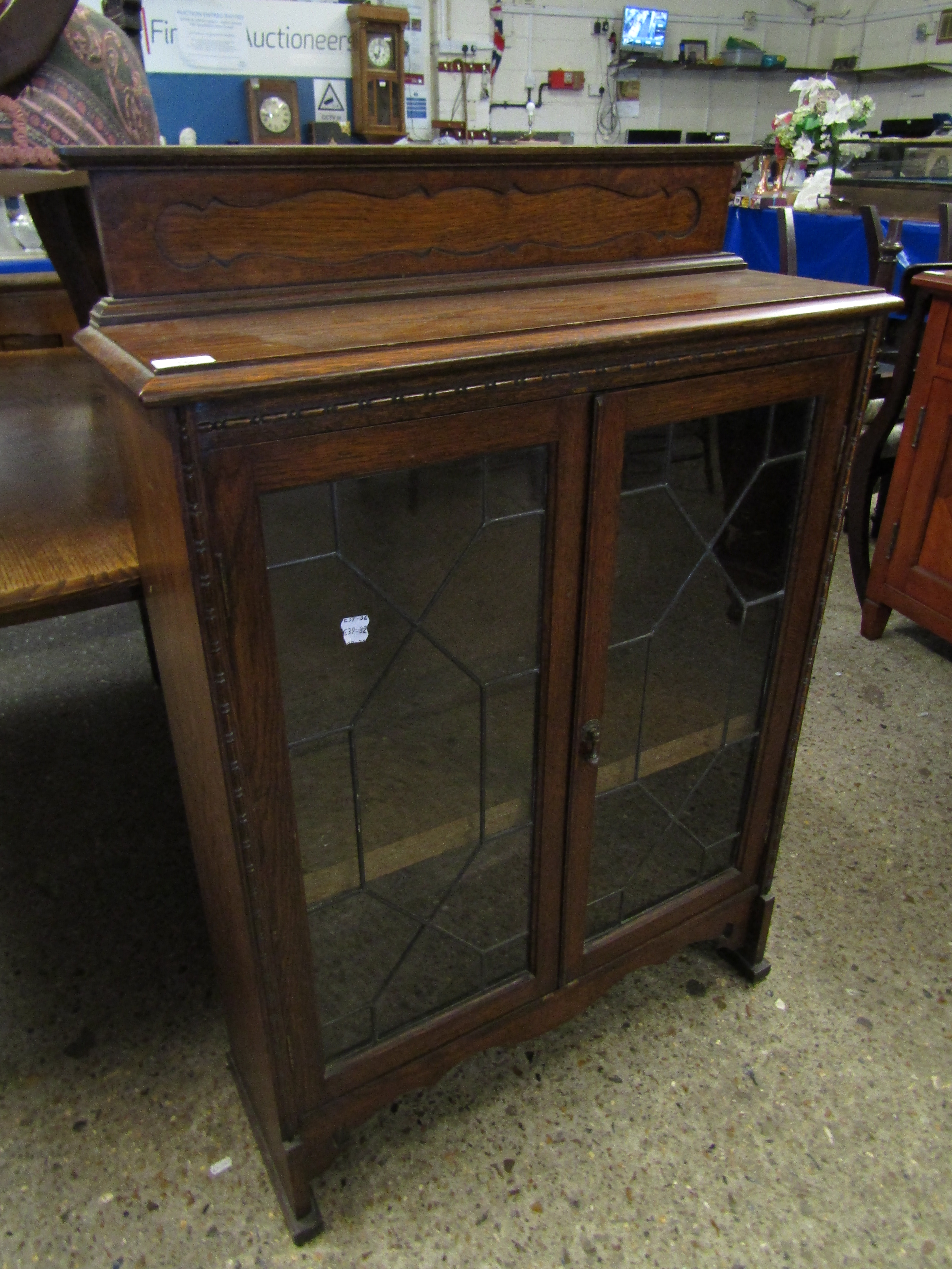 OAK FRAMED BOOKCASE WITH TWO LEADED AND GLAZED DOORS