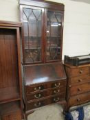 20TH CENTURY MAHOGANY BUREAU BOOKCASE WITH TWO ASTRAGAL GLAZED DOORS AND DROP FRONT FITTED WITH