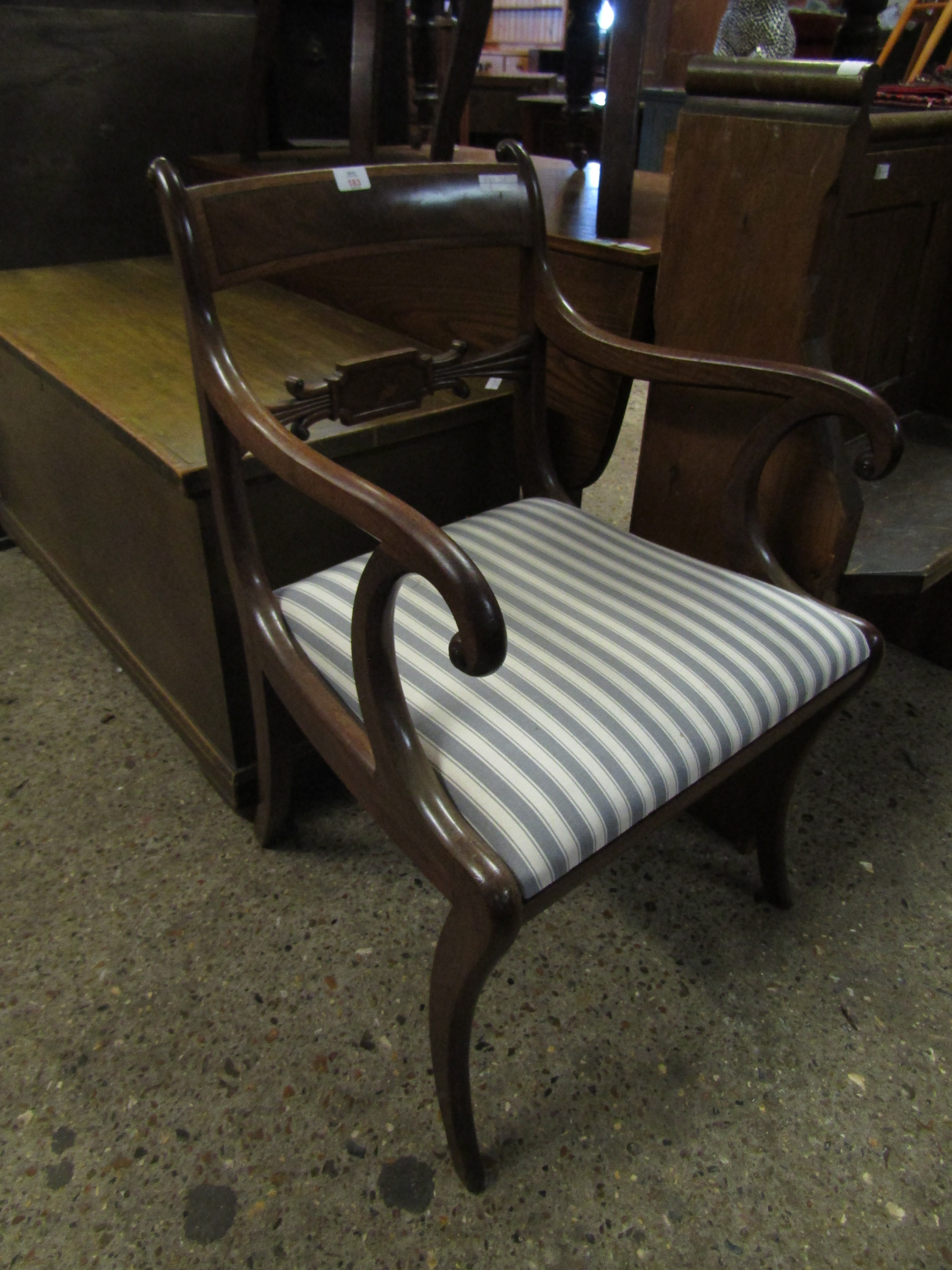 REGENCY MAHOGANY SCROLL ARMCHAIR WITH SPLAT BACK, STRIP UPHOLSTERED DROP IN SEAT AND SABER FRONT