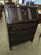 MID 20TH CENTURY OAK FRAMED DROP FRONTED BUREAU FITTED WITH THREE FULL WIDTH DRAWERS WITH TURNED