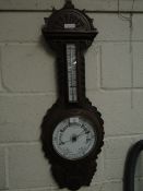 19TH CENTURY OAK CARVED FRAMED WHEEL BAROMETER WITH ENAMEL DIAL