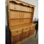 WAXED PINE DRESSER, TOP FITTED WITH TWO FIXED SHELVES, BASE WITH THREE DRAWERS OVER THREE PANELLED