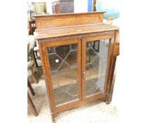 OAK FRAMED BOOKCASE WITH TWO LEADED AND GLAZED DOORS