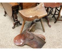 RUSTIC PINE FRAMED SADDLE STAND ON THREE SPLAYED LEGS TOGETHER WITH A LEATHER SADDLE