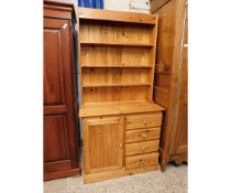 WAXED PINE FRAMED DRESSER, THE TOP FITTED WITH THREE FIXED SHELVES, THE BASE WITH FOUR DRAWERS