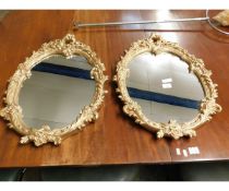 PAIR OF GILT RESIN OVAL WALL MIRRORS