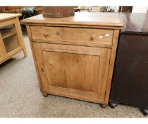 WAXED PINE FRAMED SIDE CABINET WITH SINGLE DRAWER AND PANELLED CUPBOARD DOOR