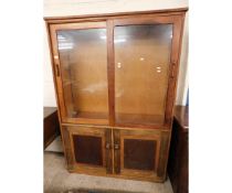 TEAK FRAMED BOOKCASE WITH TWO GLASS SLIDING DOORS TO TOP WITH TWO PANELLED CUPBOARD DOORS TO BASE