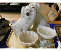 TWO JELLY MOULDS AND A PAIR OF WHITE STAFFORDSHIRE DOGS