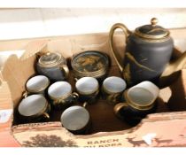 BOX OF ORIENTAL BLACK AND GOLD TEA WARES WITH CAMEO BOTTOMS