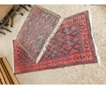 SMALL RED AND BLACK GROUND BOKHARA TYPE CARPET TOGETHER WITH A FURTHER SMALLER PRAYER RUG (2)