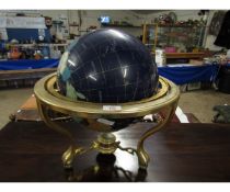 STONE INSET TERRESTRIAL GLOBE ON A BRASS STAND