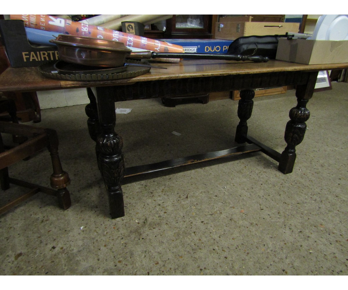 OAK REFECTORY TABLE ON FOUR CARVED PINEAPPLE LEGS AND AN H-STRETCHER